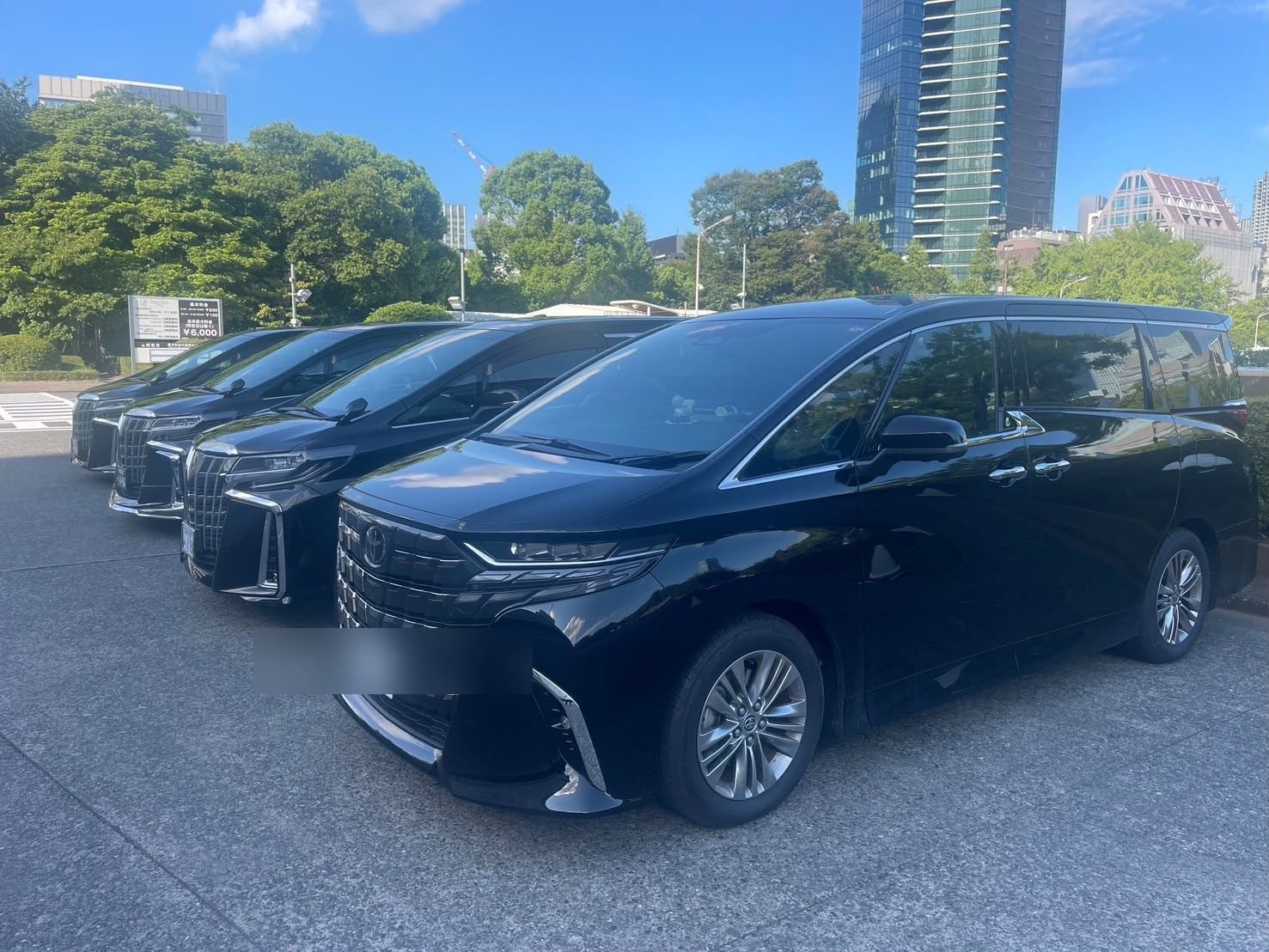 Company-operated Toyota Alphards parked in central Tokyo